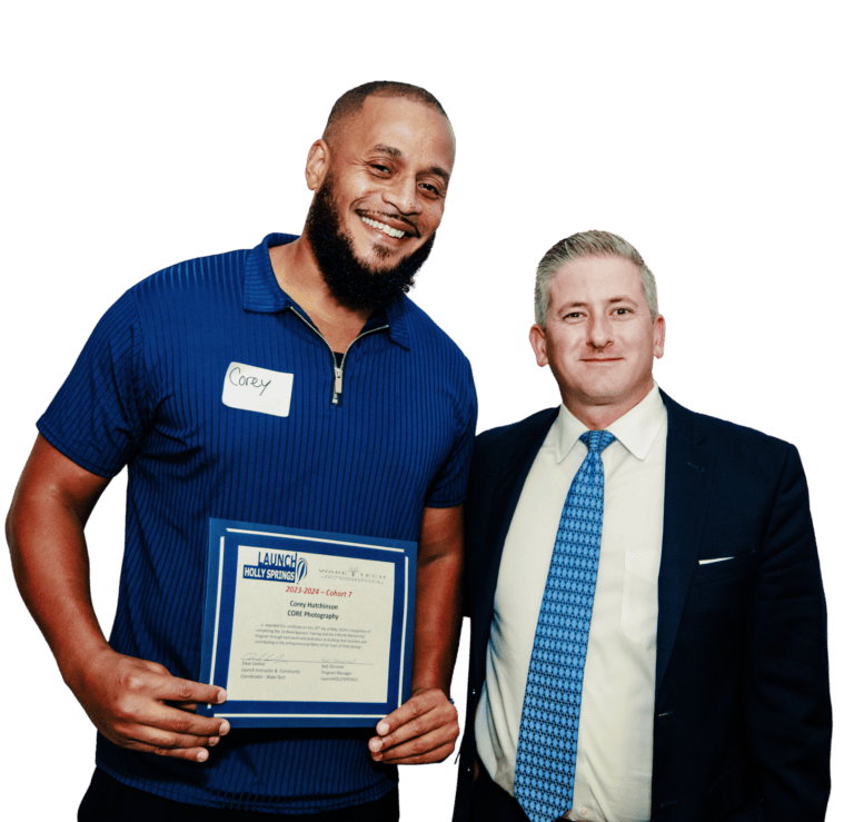 Two men at an award ceremony, one holding a certificate and wearing a blue polo shirt.