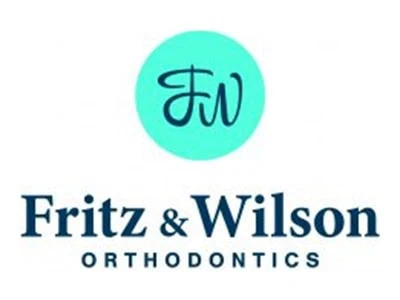 Fritz & Wilson Orthodontics logo with a turquoise circle and stylized "FW" initials.