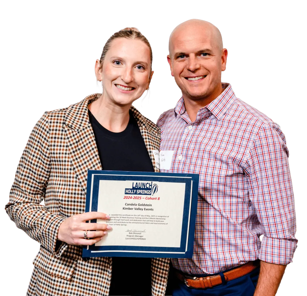 Woman and man smiling, holding a framed certificate together.